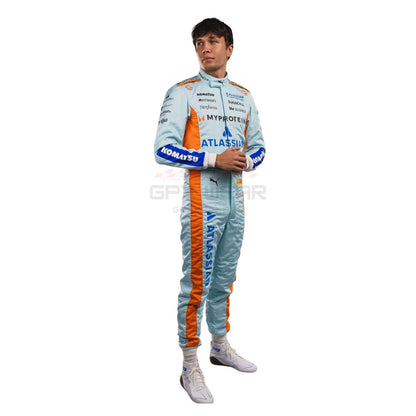 Alexander Albon wearing a light blue 2025 Williams Sao Paul GP F1 racing suit with orange accents - GPX WEAR