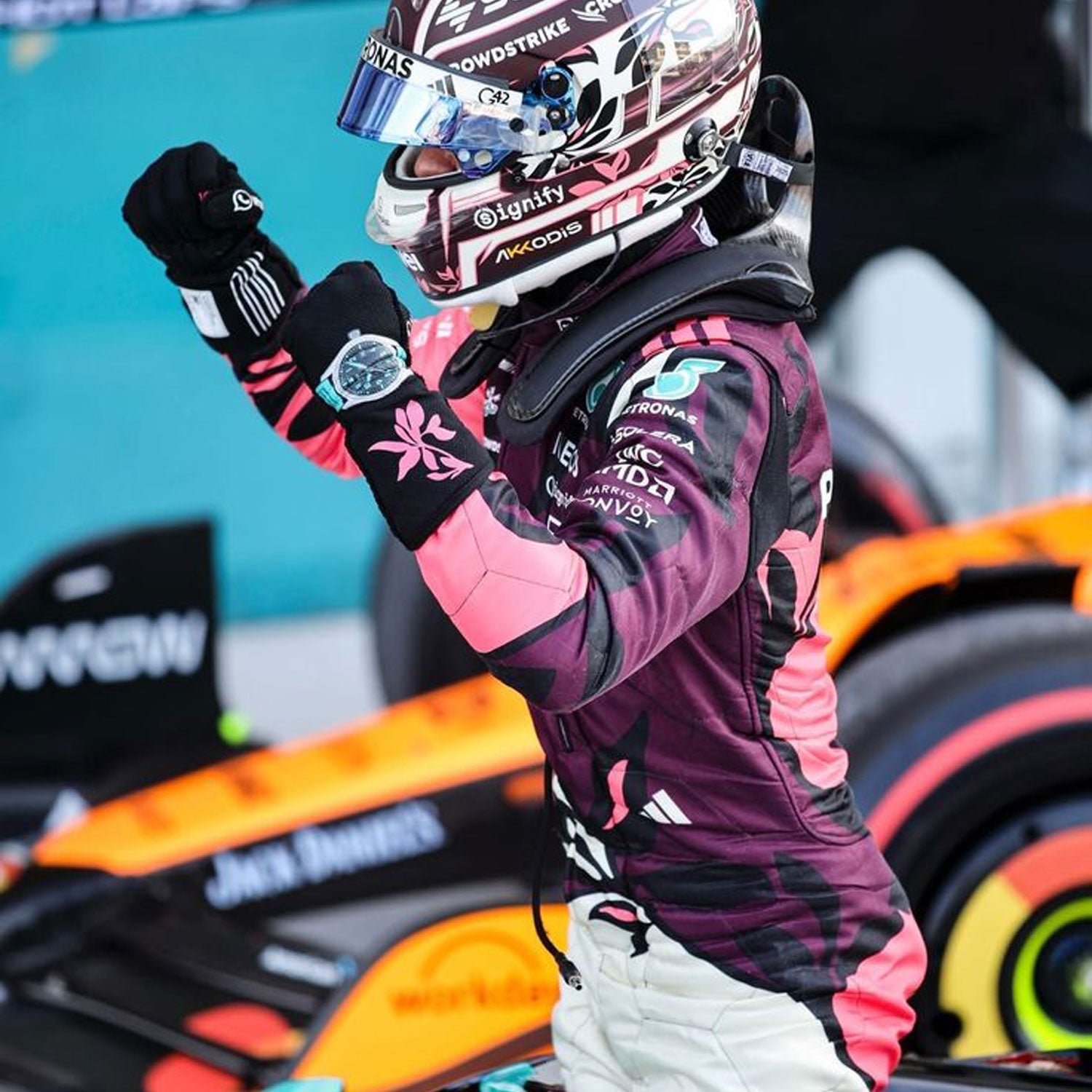 2025 Andrea Kimi Antonelli  Wearing Miami GP F1 Racing Suit  and helmet celebrating in front of a Formula 1 car