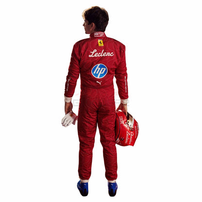 Charles Leclerc wearing a red 2025 Ferrari Monza GP F1 racing suit with various logos, holding a helmet - GPX WEAR