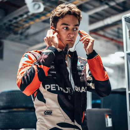 2025 George Russell Miami GP F1 Racing Suit adjusting earphones in a garage 