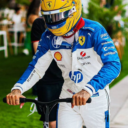 2025 Lewis Hamilton Miami GP F1 Racing Suit with various sponsor logos, holding a scooty.
