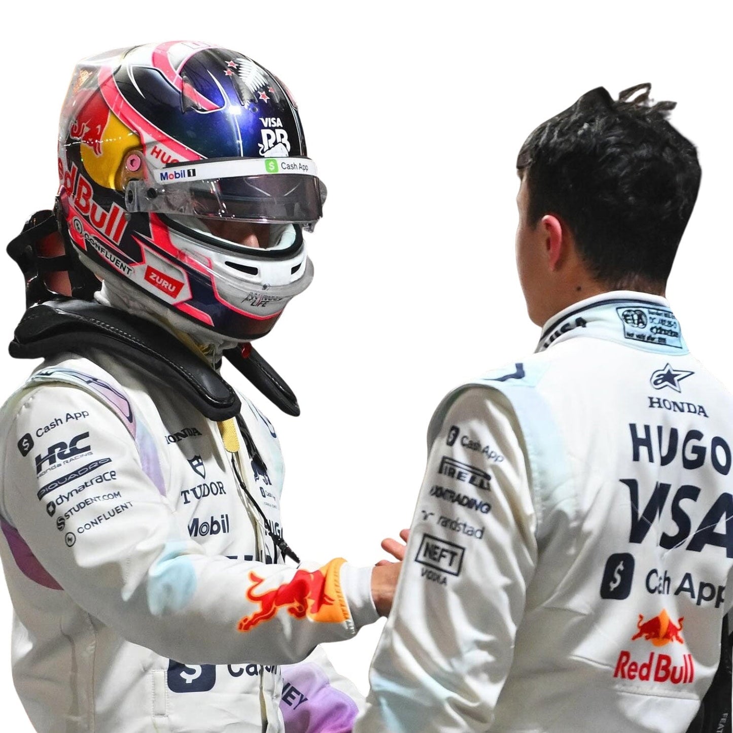 Two Formula 1 drivers shaking hands, one wearing a helmet with visible branding.