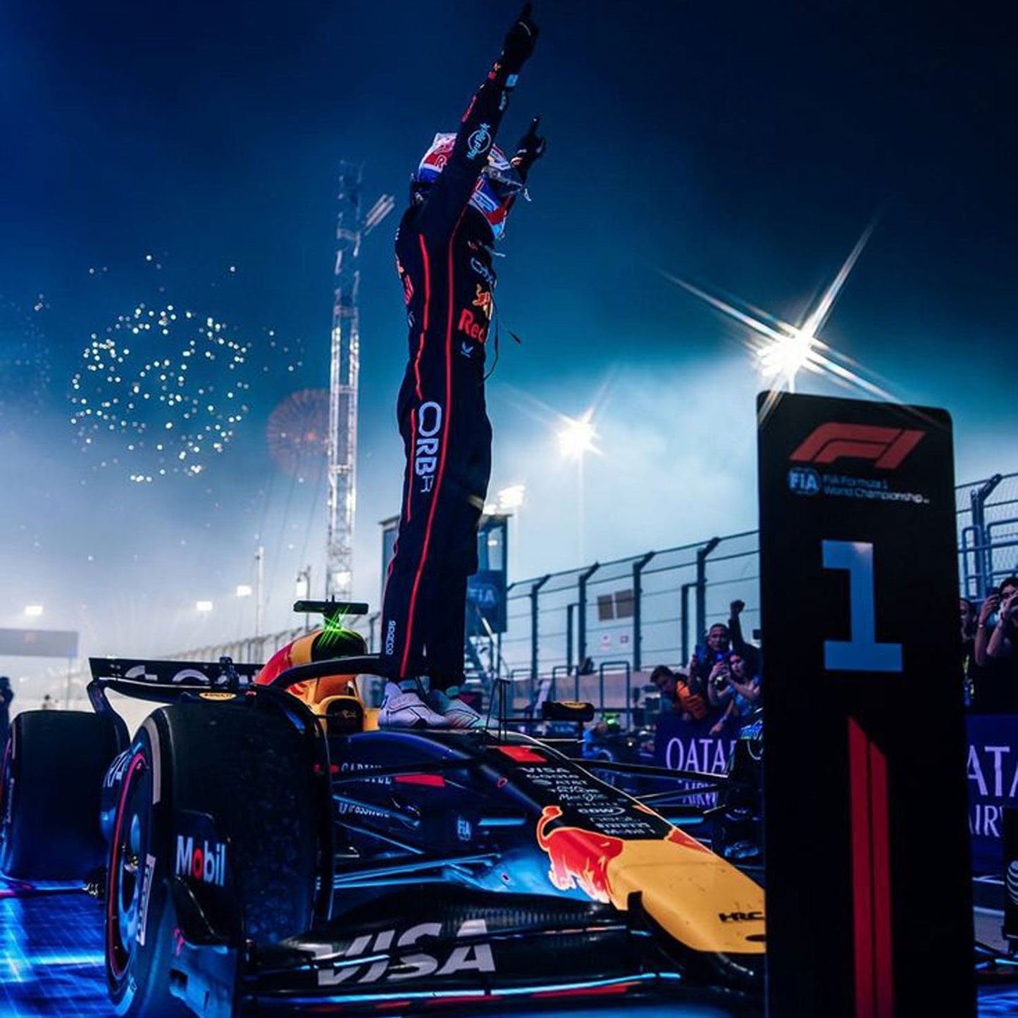 Max Verstappen wearing a navy blue 2025 Red Bull F1 racing suit and Celebrate - GPX WEAR