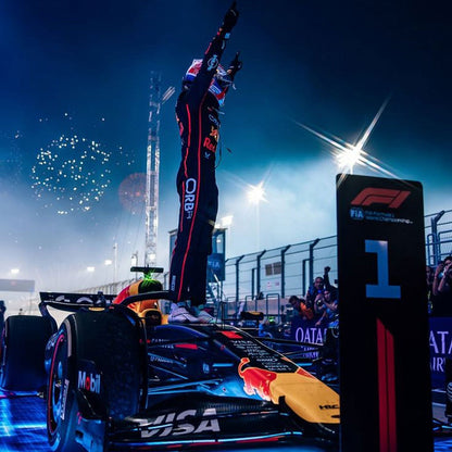 Max Verstappen wearing a navy blue 2025 Red Bull F1 racing suit and Celebrate - GPX WEAR
