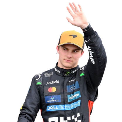 2025 Oscar Piastri waving while wearing Abu Dhabi GP F1 Racing Suit Team McLaren