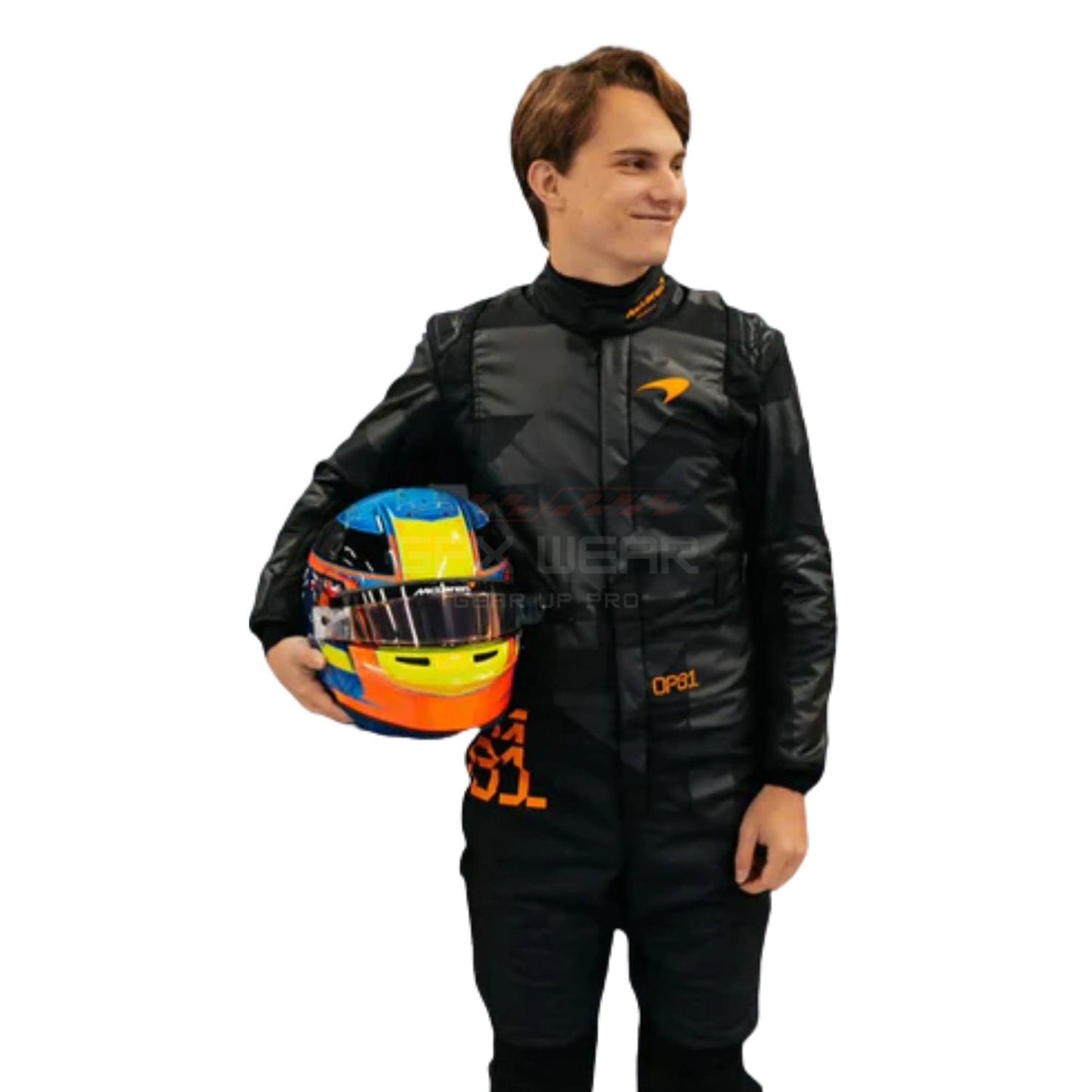 2025 Oscar Piastri F1 Race Suit holding a colorful helmet on a white background