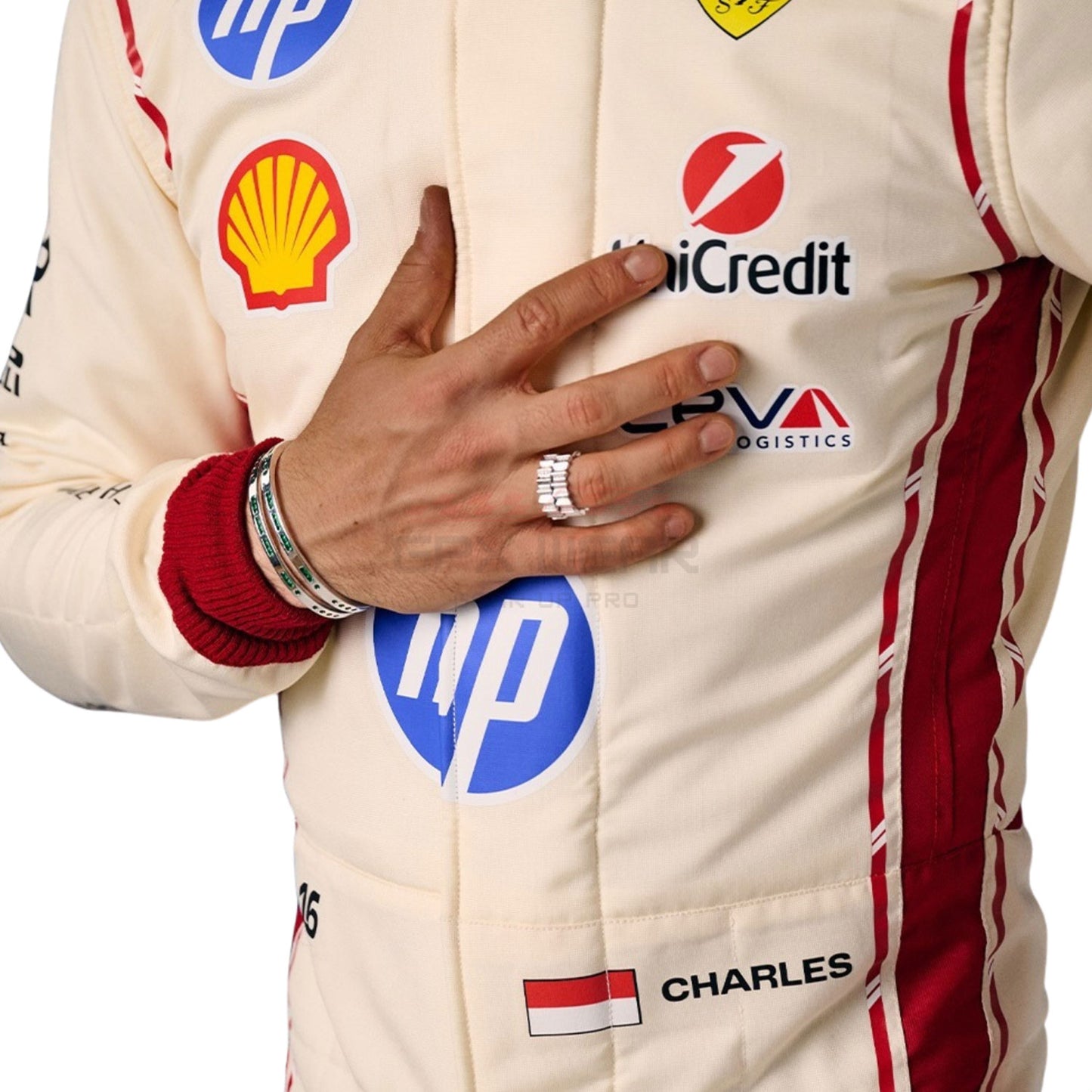 Close-up of Charles Leclerc wearing a 2026 Monaco GP F1 racing suit with various sponsor logos - GPX WEAR
