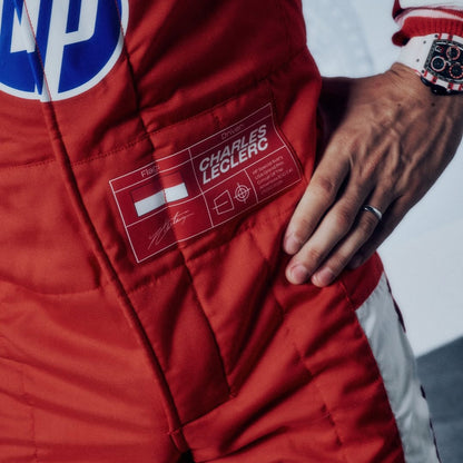 Charles Leclerc 2026 USGP Ferrari F1 racing suit with various sponsor logos - GPX WEAR