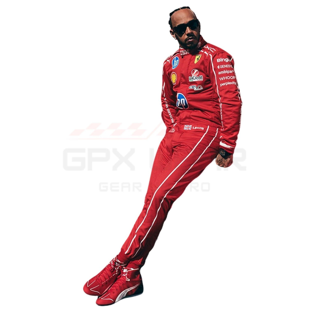 A full-body photo of Lewis Hamilton wearing a red Scuderia Ferrari racing suit with sponsor logos, matching red Ferrari shoes, and black sunglasses, posed against a solid white background.