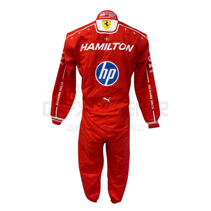 A red long-sleeve racing suit with white trim, featuring prominent 'HAMILTON' text and the 'hp' logo on the back, with a Scuderia Ferrari crest at the neck. The suit is displayed flat against a white background.