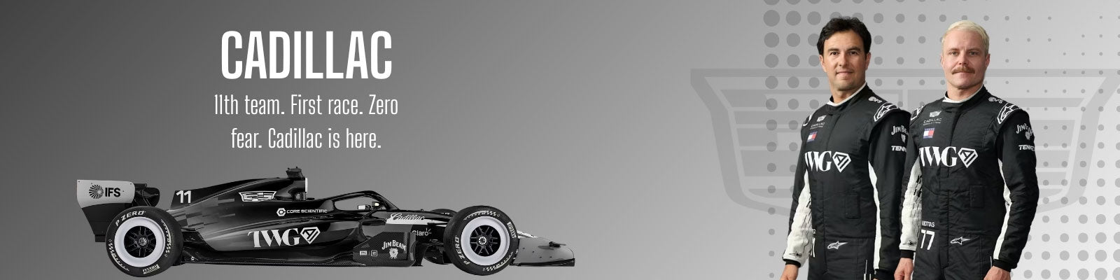 Two people in racing suits standing next to a Formula 1 car with Cadillac branding on a gray background - GPX Wear