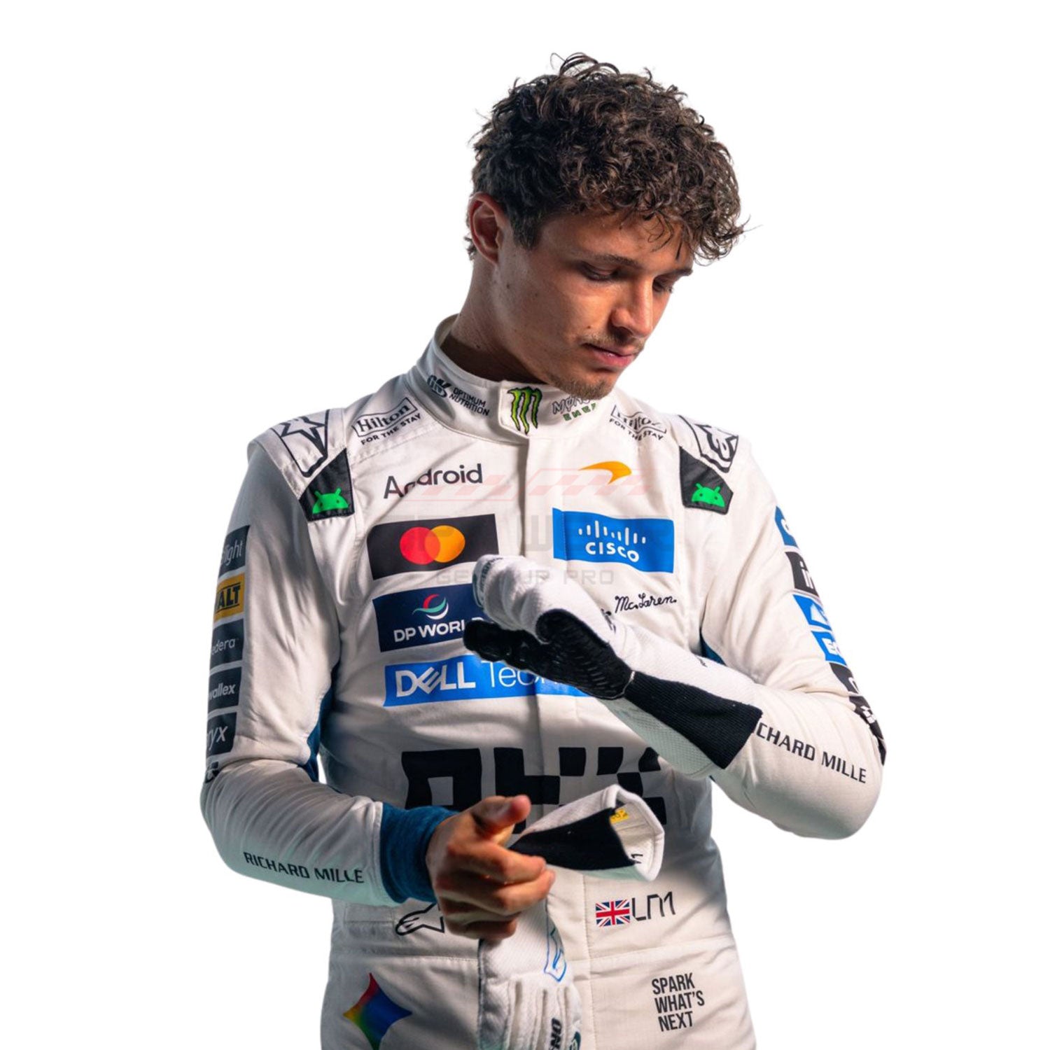 A 2026 Lando Norris Silverstone British GP in a white racing suit with multiple sponsor logos, including Mastercard, Dell Technologies, and Daniel Ricciardo, looking down while holding a small object against a plain white background.